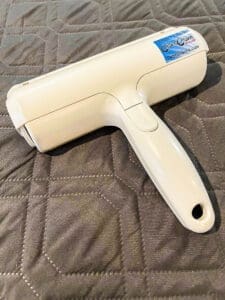 The Chom Chom Roller that removes dog hair from furniture, blankets and carpeting.